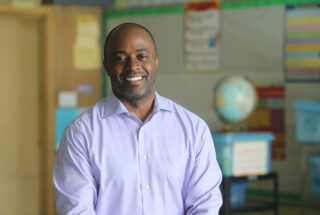 A portrait of Tony Thurmond in a classroom