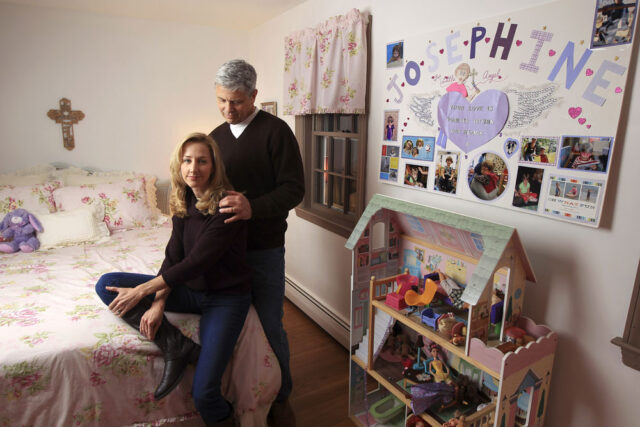 A photo of Bob and Michelle Gay in a child's bedroom