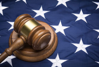 A gavel on the blue part of the American flag